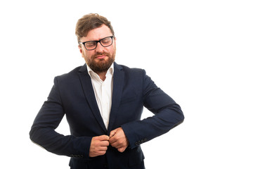 Wall Mural - Portrait of business man buttoning his jacket gesture.