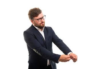 Wall Mural - Portrait of business man arranging his sleeve gesture.