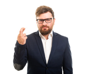 Wall Mural - Portrait of business man showing cross fingers gesture.