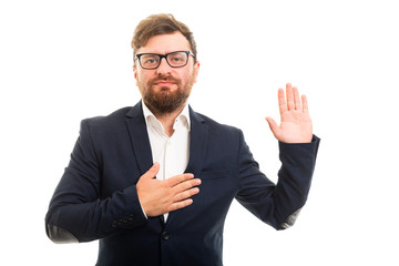 Wall Mural - Portrait of business man showing oath gesture.