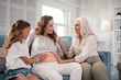 © Viacheslav Yakobchuk - Visiting mother. Good-looking pregnant woman coming to her mother with older little cute daughter