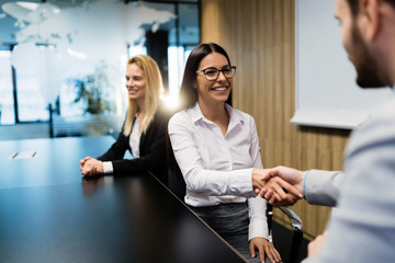 Portrait of business couple in conference room