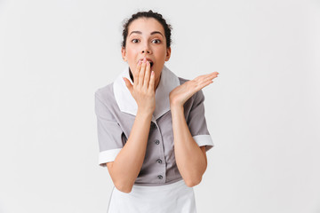 Canvas Print - Portrait of a shocked young housemaid