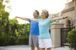 © Blue Jean Images - Cheerful senior Chinese couple exercising outside
