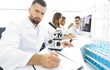 © ASDF - young scientist works in the lab.