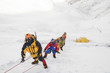 © Westend61 - Roped team of mountaineers wearing oxygen masks