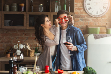 Happy couple cooking healthy food together