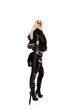 © faestock - full length portrait of blonde girl wearing lack fantasy warrior outfit. standing pose wit bak to the camera. isolated on white studio background.