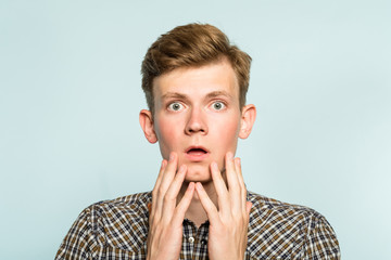 Wall Mural - omg unbelievable shock amazement. dumbfounded man with open mouth. portrait of a young guy on light background. emotion facial expression and reaction concept.