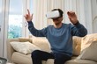 © Wavebreak Media - Man using virtual reality headset in living room
