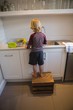 © Wavebreak Media - Boy working in kitchen at home