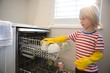 © Wavebreak Media - Boy arranging utensils in kitchen trolley