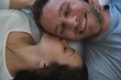 © Wavebreak Media - Couple lying on bed in bedroom