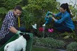 © Wavebreak Media - Couple planting a plant in the garden