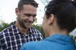 © Wavebreak Media - Couple looking at each other in the garden