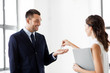 © Syda Productions - real estate business, sale and people concept - realtor giving key to customer or new office owner
