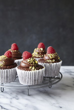 Chocolate Cupcakes With Chocolate Ganache And Raspberries