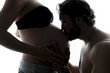 © Louis-Photo - against the light portrait of pregnant couple