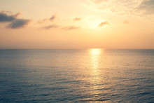 Sunset Sea Over The Horizont. Beautiful Ocean Sunshine Landscape, Shimmering Twilight With Yellow Colors, Warm Marine Dusk Sun, Reflecting Sunlight Over The Water