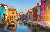 Fototapeta  - Lovely house facade and colorful walls in Burano, Venice. Burano island canal, colorful houses and boats, Venice landmark, Italy. Europe