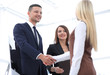 © ASDF - business colleagues shaking hands after a successful presentation.