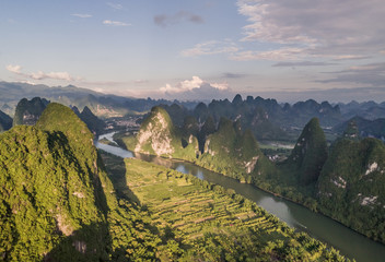 Wall Mural - aerial view of farmland and mountain around the ancient town of Xingping, China