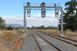 a signal bridge and gantry at a country railway station in Australia