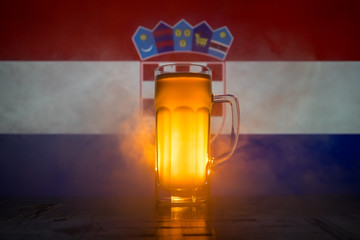 Wall Mural - Soccer 2018. Creative concept. Single beer glass with beer on table ready to drink. Support your country with beer concept. Selective focus