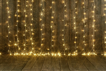 dark wood background with lights, wall and floor, abstract holiday backdrop, copy space for text