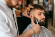 © puhhha - Beard Cut In Barber Shop. Barber Cutting Beard