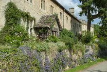 Summer Time View Of Cotswold Cottage With Half Timbered Porch, Summer Flowers And Lavender With A Rustic Stone Facade Near Iford Manor, Iford Near Bradford Upon Avon, Wiltshire, UK