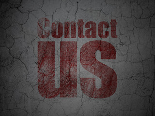 Advertising concept: Red Contact Us on grunge textured concrete wall background