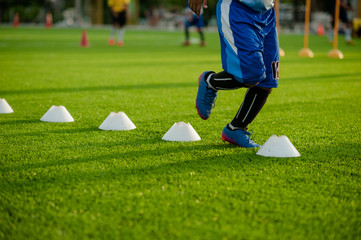 Soccer Football Training Session for Kids. Boys Training Football on the Pitch. Soccer Stadium in the Background