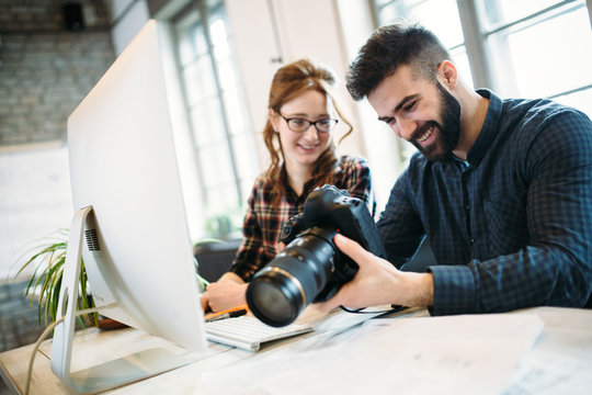 Two young designers working in modern office