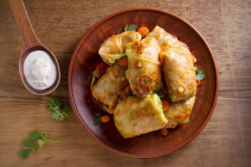 Wall Mural - Stuffed cabbage leaves with meat, rice and vegetables. Chou farci, dolma, sarma, sarmale, golubtsy or golabki - popular dish in many countries. overhead, horizontal