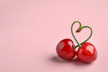 Sweet Red Cherries On Color Background