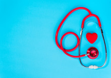 Red Heart And Stethoscope On On Blue Background.