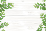 Fototapeta  - Wood plank pattern and texture with green leaves for natural  background. Abstract background for product presentation. Realistic vector.