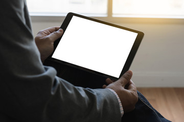 Poster - digital tablet computer close up man using tablet hands man multitasking with isolated screen