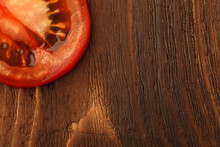 Fresh Tomato Halves On The Wooden Table