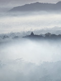 Fototapeta Na ścianę - Borobudur Temple in a beautiful foggy sunrise seen from Punthuk Setumbu Hill