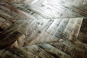 Wall Mural - Vintage wooden parquet background. Top view of wooden texture. Herringbone, chevron flooring pattern. 