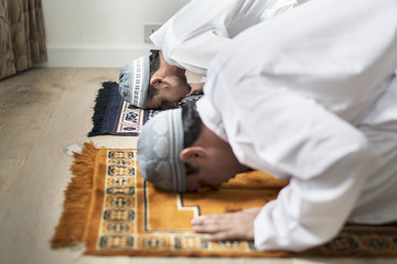 Wall Mural - Muslim prayers in Sujud posture