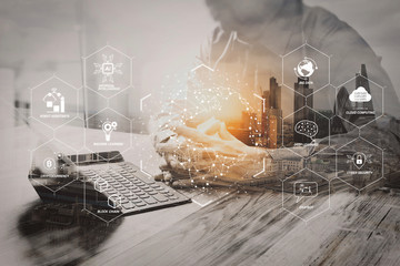 Leinwandbilder - Double Exposure,businessman working with new start up project.using smart phone digital tablet docking smart keyboard on wooden desk,sun effect