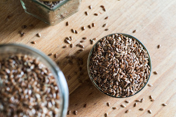 health food linseed flaxseed grain cereal in bowl on wooden table