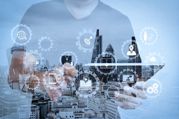 Poster - Double exposure of success businessman using digital tablet with london building and social media diagram