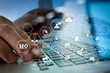 © everythingpossible - close up of hands using laptop and holding credit card as Online shopping concept