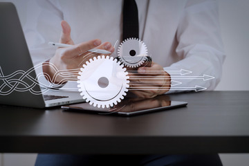 Poster - close up of businessman working with smart phone on wooden desk in modern office