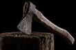 © LIGHTFIELD STUDIOS - close up view of vintage axe on wooden stump isolated on black