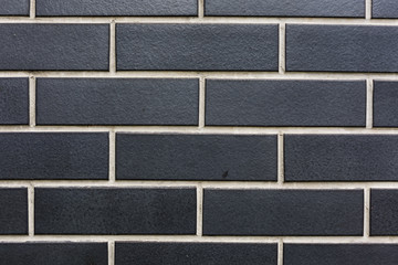 Wall Mural - stone black bricks with white seamswall horisontal pattern texture background close-up